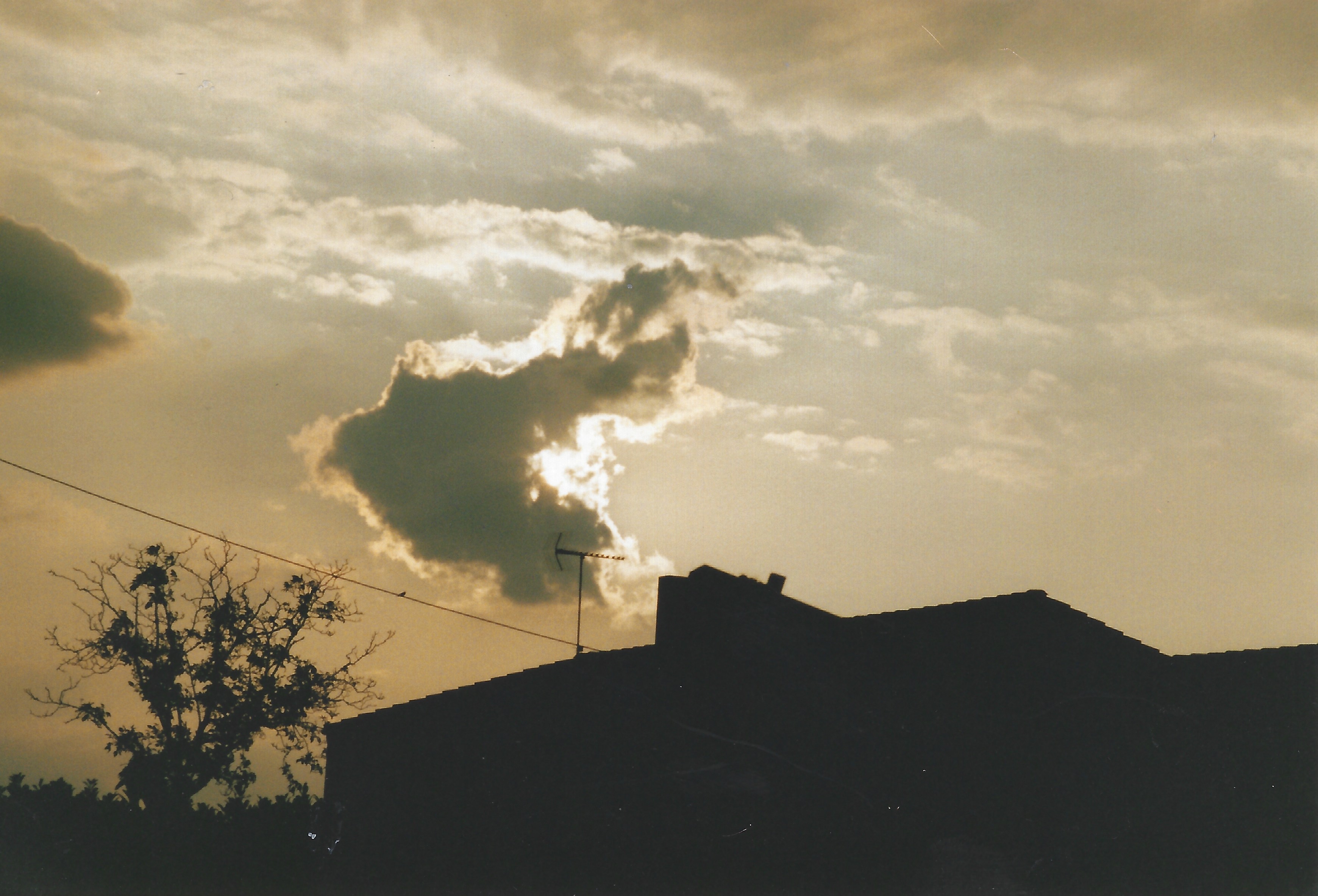 Old picture of a cloudy French sunset